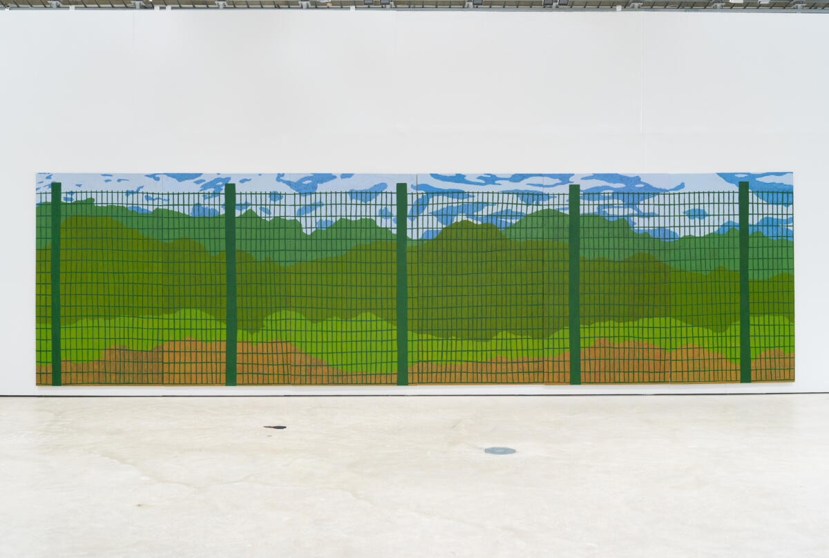 A large painting depicting a metallic fence and green trees behind it.