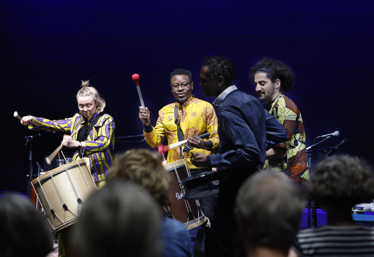 Global music students performing as an intercultural ensemble.